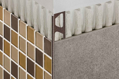 Schluter FINEC-TS edge tile trim on wall corner behind tiles