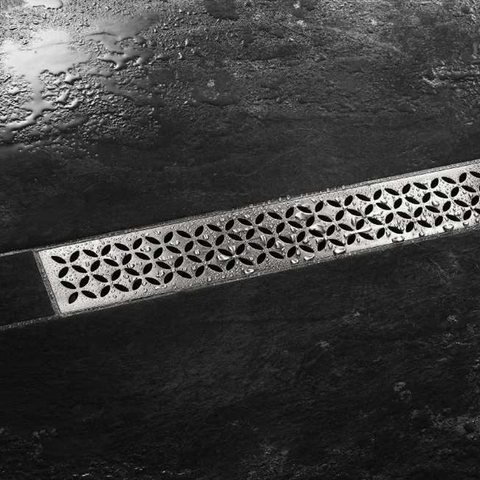 Schluter KERDI LINE STYLE Floral design drain grate between floor tiles
