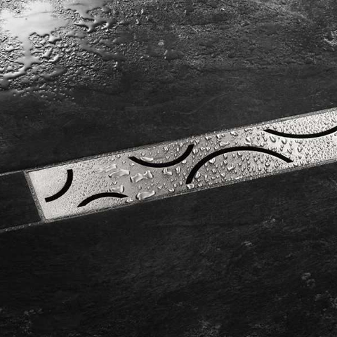 Schluter KERDI LINE CURVE drain grate installed between tiles